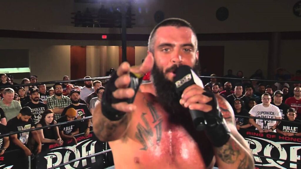 Jay Briscoe holds microphone in Ring of Honor ring