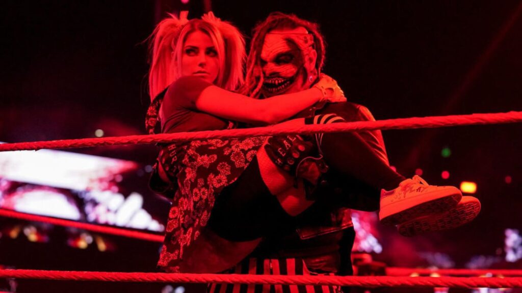 WWE Superstar The Fiend carries Alexa Bliss in his arms